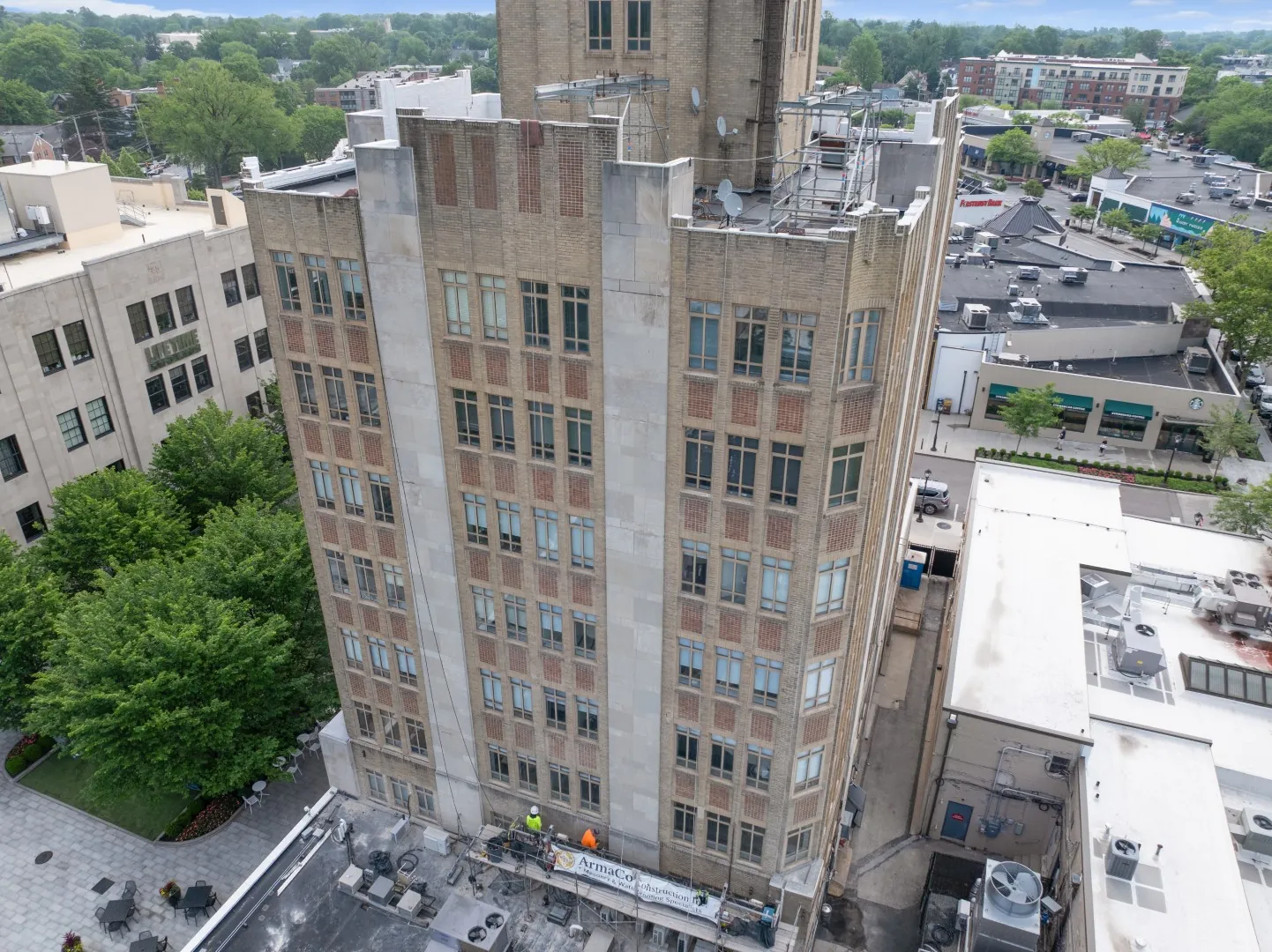 Elevated view of a masonry building and its surroundings