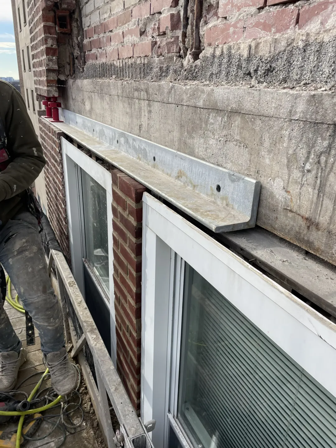 Exposed lintel above a window opening